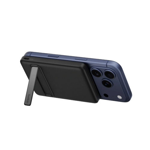 Belkin slim Qi2 magnetic power bank 5K in black on an iPhone with kickstand open