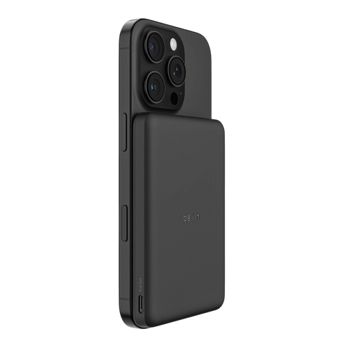 Belkin BoostCharge slim magnetic power bank 5K in black attached to an iPhone