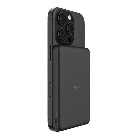 Belkin BoostCharge slim magnetic power bank 5K in black attached to an iPhone