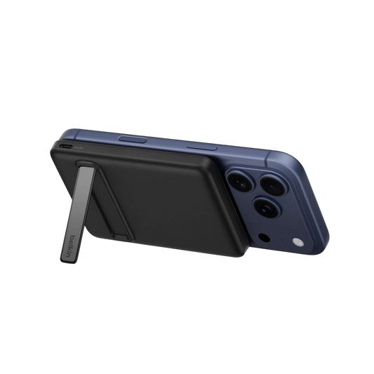 Belkin slim Qi2 magnetic power bank 5K in black on an iPhone with kickstand open