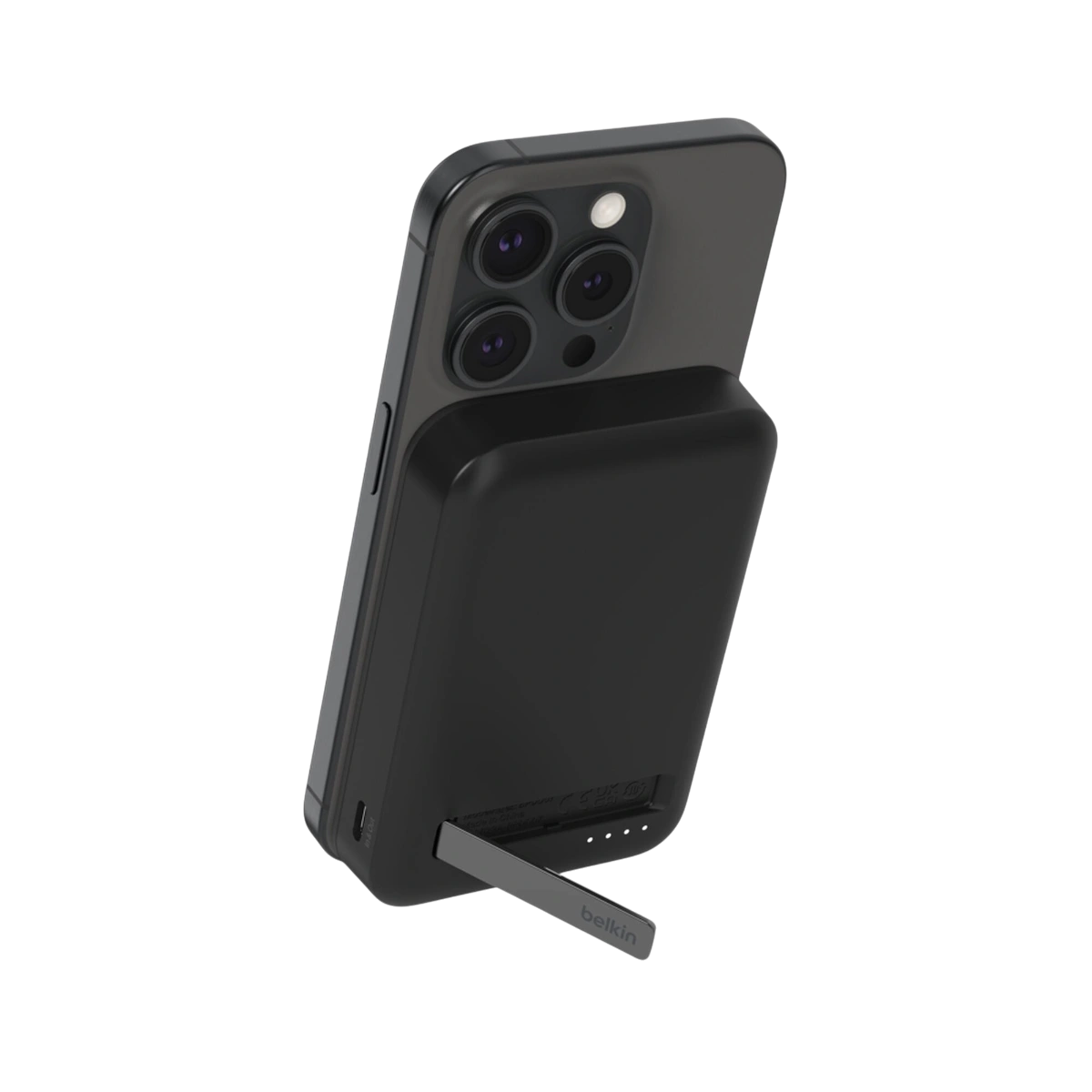 Belkin BoostCharge Pro Qi2 magnetic power bank in black attached to an iPhone with kickstand open